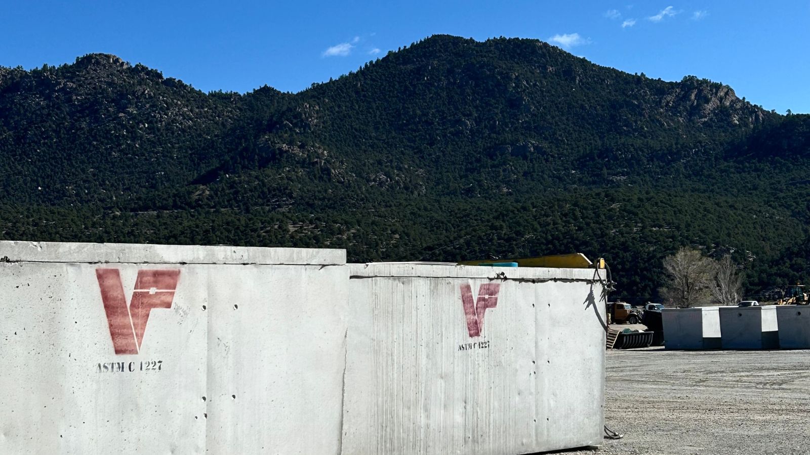 tank plus green mountains